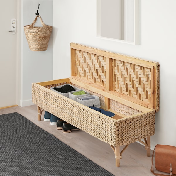 A handmade rattan TOLKNING bench with storage