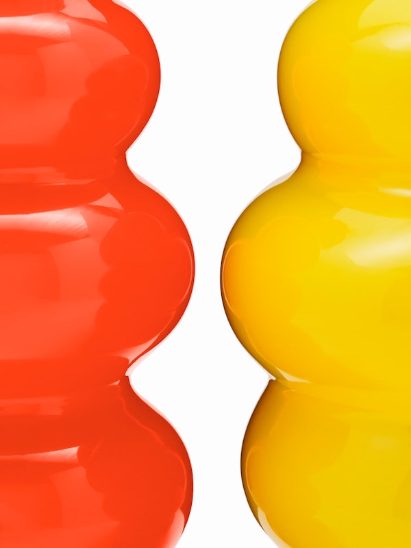 An orange KÄLLARHALS vase